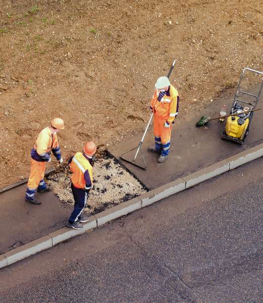 workers-plug-a-hole-in-the-sidewalk-removing-the-o-2025-10-16-05-40-31-utc